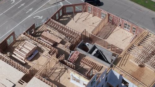 Aerial Top Down Wide View of Wood Frames and Foundations of Houses Under Construction