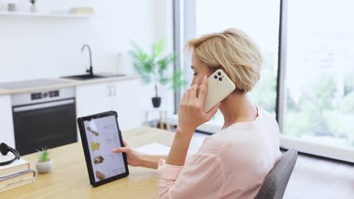 Caucasian Woman Ordering Food Online Using Tablet and Phone