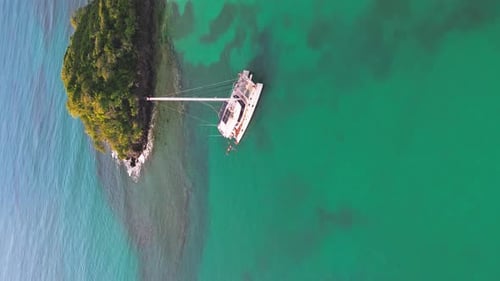 Vertical Shot Of Catamaran Yacht Sailing Near Playa Bonita Island In Las Terrenas, Dominican Republi