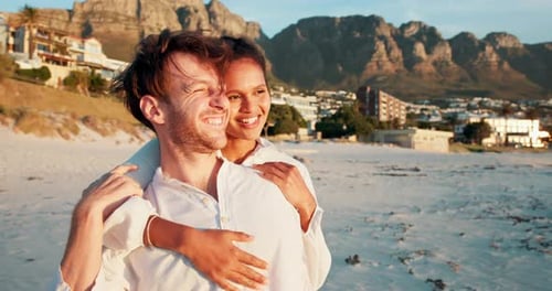 Happy couple, hug and relax on beach with love, travel date and windy Valentines day