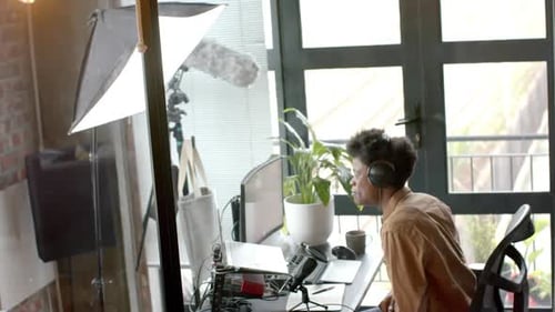 Young Adult Recording a Podcast at Home Studio