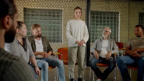 Woman Speaking at Diverse Support Group Meeting