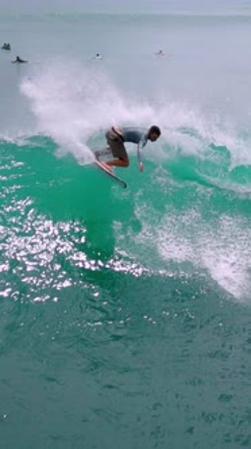 Surfer Rides Wave Male Athlete Glides On Turquoise Ocean Wave