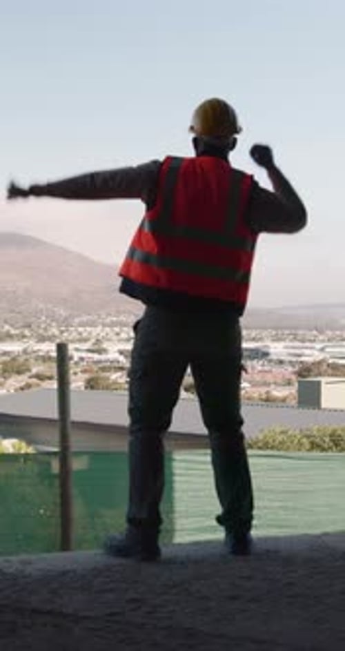 Celebration, excited and man with fist pump at construction site, development achievement