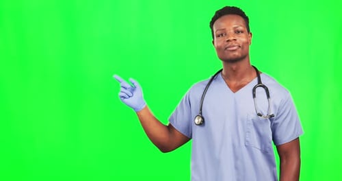 Happy man, face and doctor on green screen pointing to mockup in agreement, yes or approval
