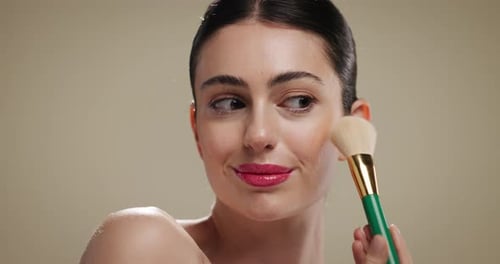 Woman, makeup brush and foundation for blush, beauty and application on studio background