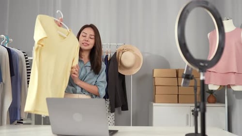 Woman Presenting Fashion Clothing During Live Broadcast
