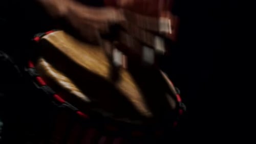 Close Up of African Man Hands Drumming on Bongo in Slow Motion