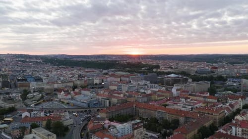 Panoramic drone shot overlooking the cityscape of Prague, sunset in Czech Republic