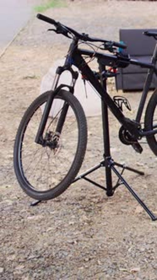 Black Mountain Bike on a Stand Outdoors