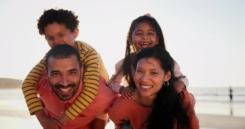Mother, father and children with piggy back on beach or face for summer adventure