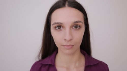 Woman Smiles Intimately at the Camera