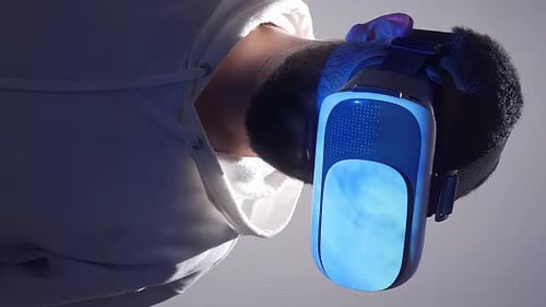 Man Wearing VR Headset with Blue Screen
