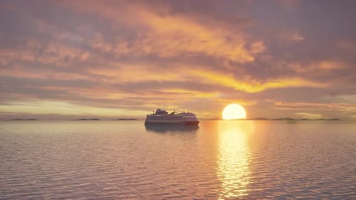 Luxury Cruise Ship Sailing on a Gentle Ocean at Sunset or Sunrise