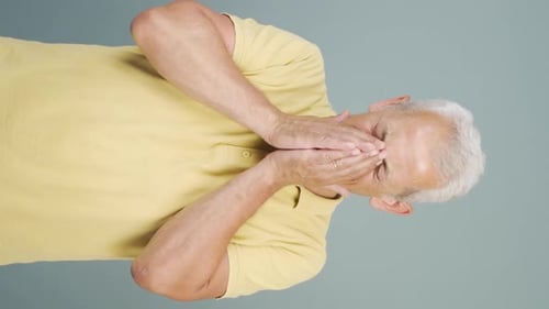 Vertical video of Crying man.