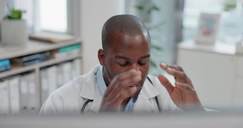 Healthcare, headache and computer with a doctor black man in a hospital