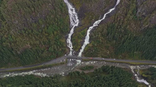 Aerial video of Latefossen waterfall in remote mountain terrain
