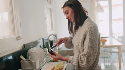 Woman Preparing Healthy Avocado Toast in Kitchen