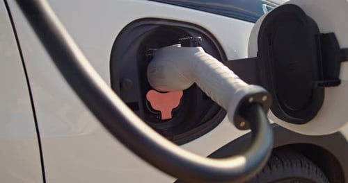 Electric Car is Connected to an Electric Filling Station