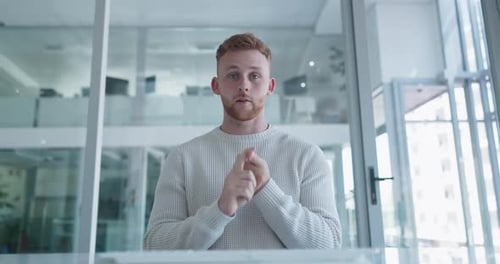 Man Talking in Modern Office Explaining Online