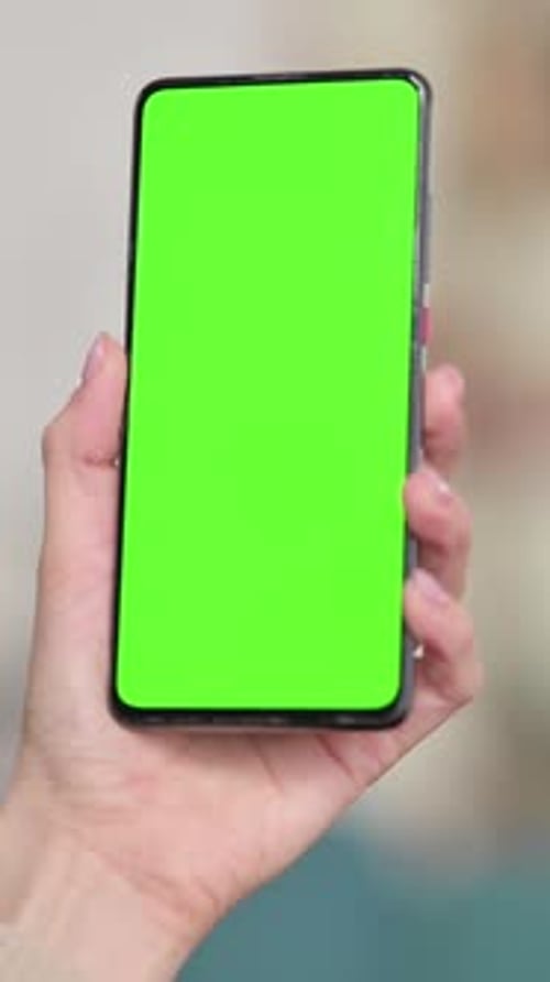 Woman Using Smartphone with Green Screen, Chroma Screen , Vertical Video
