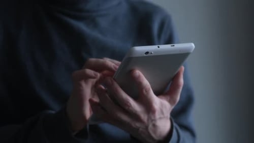 Adult using Tablet Technology Close Up