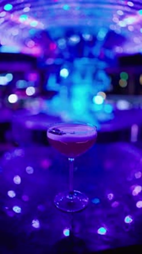 Cocktail on Bar Counter with Colorful Lighting