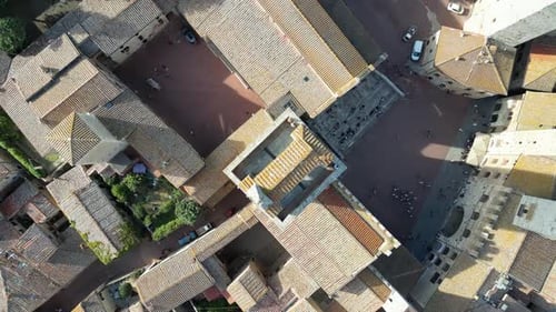 Aerial view of medieval rooftops and buildings, Italy.