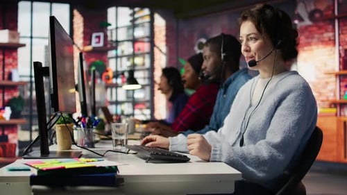 Friendly Call Center Employee Talking in Audio Headset Assisting Customers