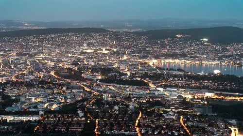 Zurich Old Town and Lake in Switzerland. Day to Night Time Lapse Seen from Uetliberg Viewpoint