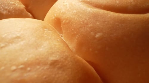 Golden Brown Baked Bread Rolls Close Up