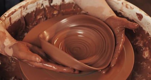 Hands of Potter Breaks Clay Jug on Potter's Wheel Pottery Training Close Up