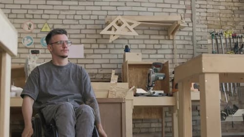Wheelchaired Carpenter at Spacious Workshop