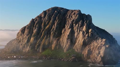 Morro Rock Rising Above Pacific Ocean at Morro Bay California on Sunny Day