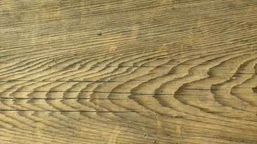 Planche de bois rustique avec motif de grain audacieux.