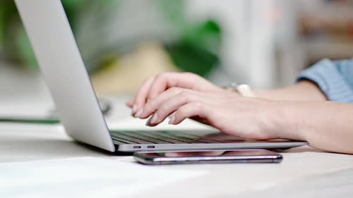 Business Woman Typing on Laptop Keyboard at Office Desk Background