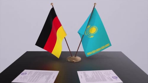 Germany and Kazakhstan Flags with Contracts on Table