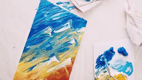 Applying Paint with Palette Knife on Canvas