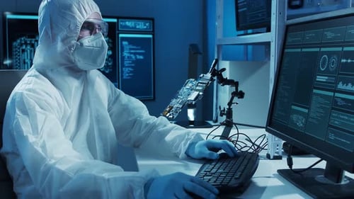 Microelectronics Engineer Works in a Modern Scientific Laboratory on Computing Systems and