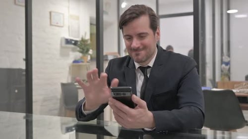 Excited Middle Aged Businessman Earning Money Online on Phone