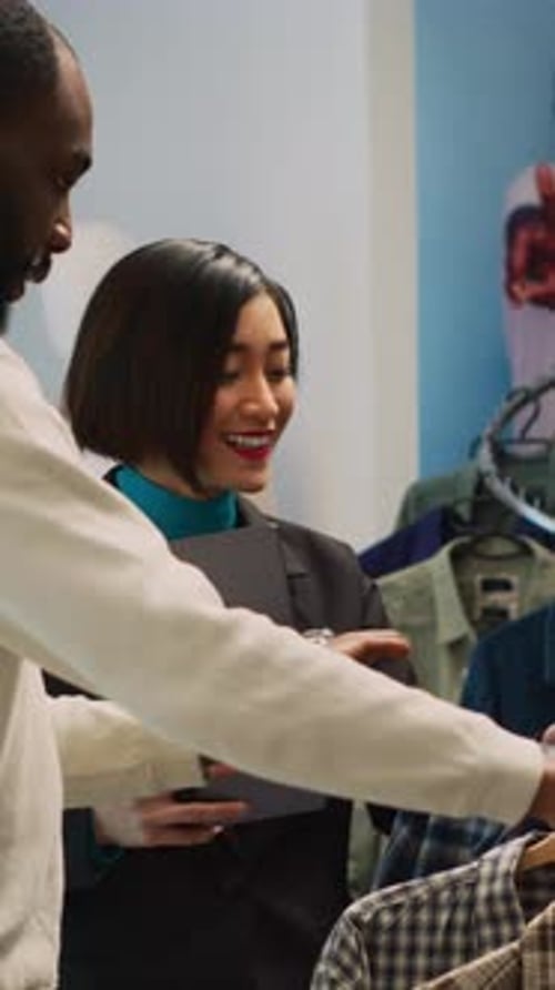 Man and Woman Discuss Plaid Shirt in Store