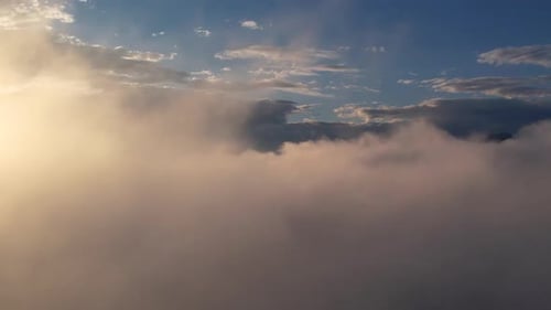 Dreamy Clouds Illuminated by Golden Light, Aerial View