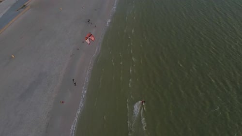 Aerial view of kitesurfing on the sea during sunset, Netherlands