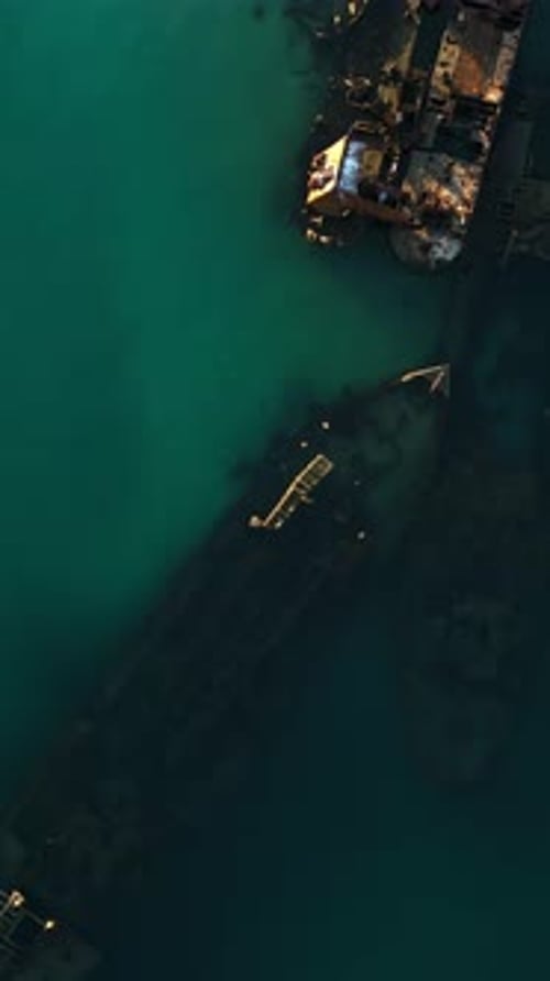 Vertical drone top down Tangalooma Wreck section turquoise clear water sand below Moreton Island