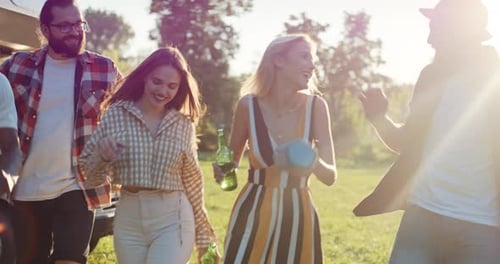 Happy Friends Walking and Laughing Outdoors
