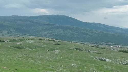 Aerial View of Countryside Landscape Clouds with Shades of Purple Orange and Green Vegetation