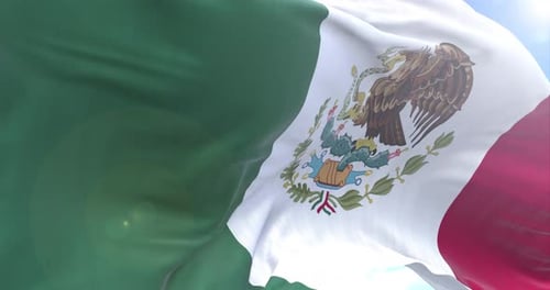 Realistic Mexican Flag Waving in Wind with Sunny Sky Background