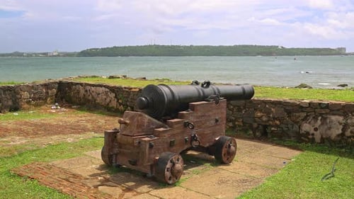 4K Parallax of an ancient Dutch cannon on the fort wall of Galle overlooking the water in Sri Lanka