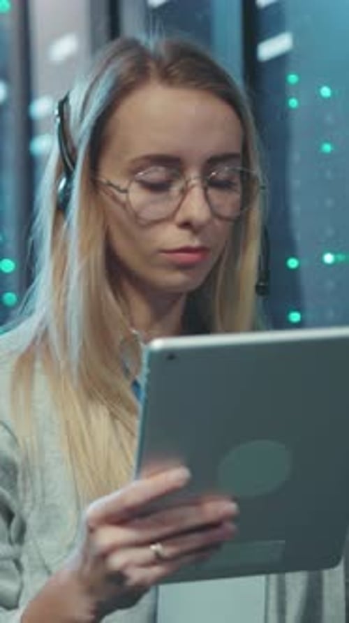 Woman Uses Tablet in Data Center Server Room