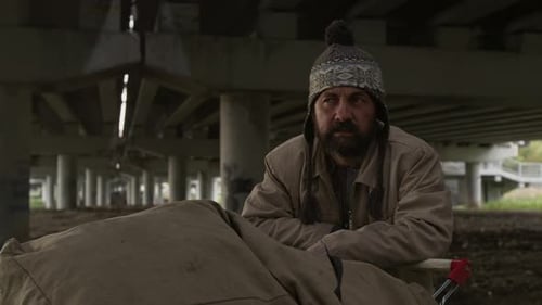 Man sitting on chair in urban area